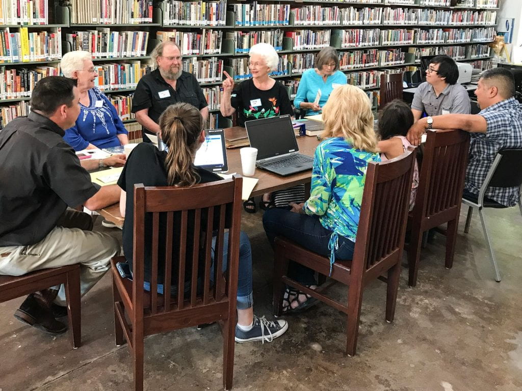 Community group talks at the library.